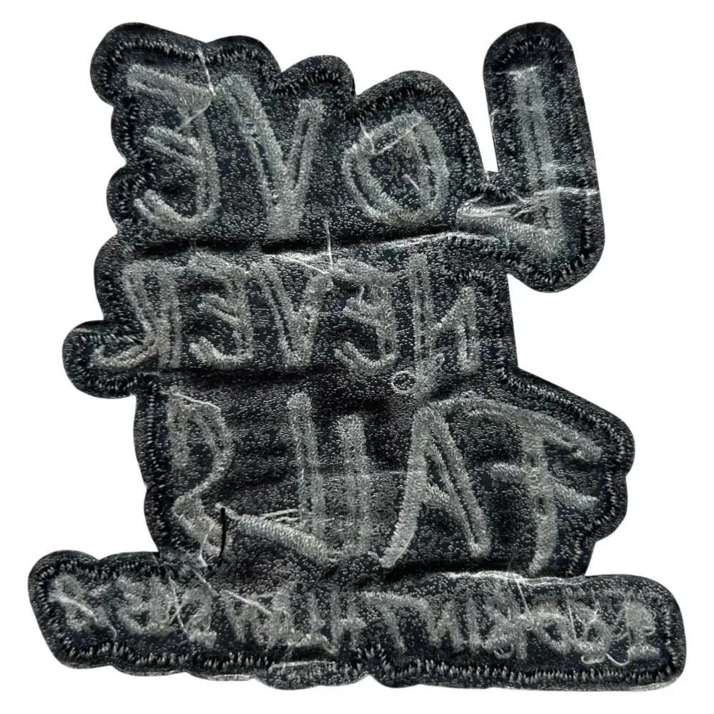 Love Never Fails Iron On Patch